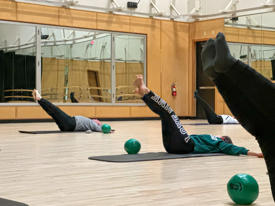 Professor+Simmers+guides+yoga+class+during+stretches+on+Feb.+16.