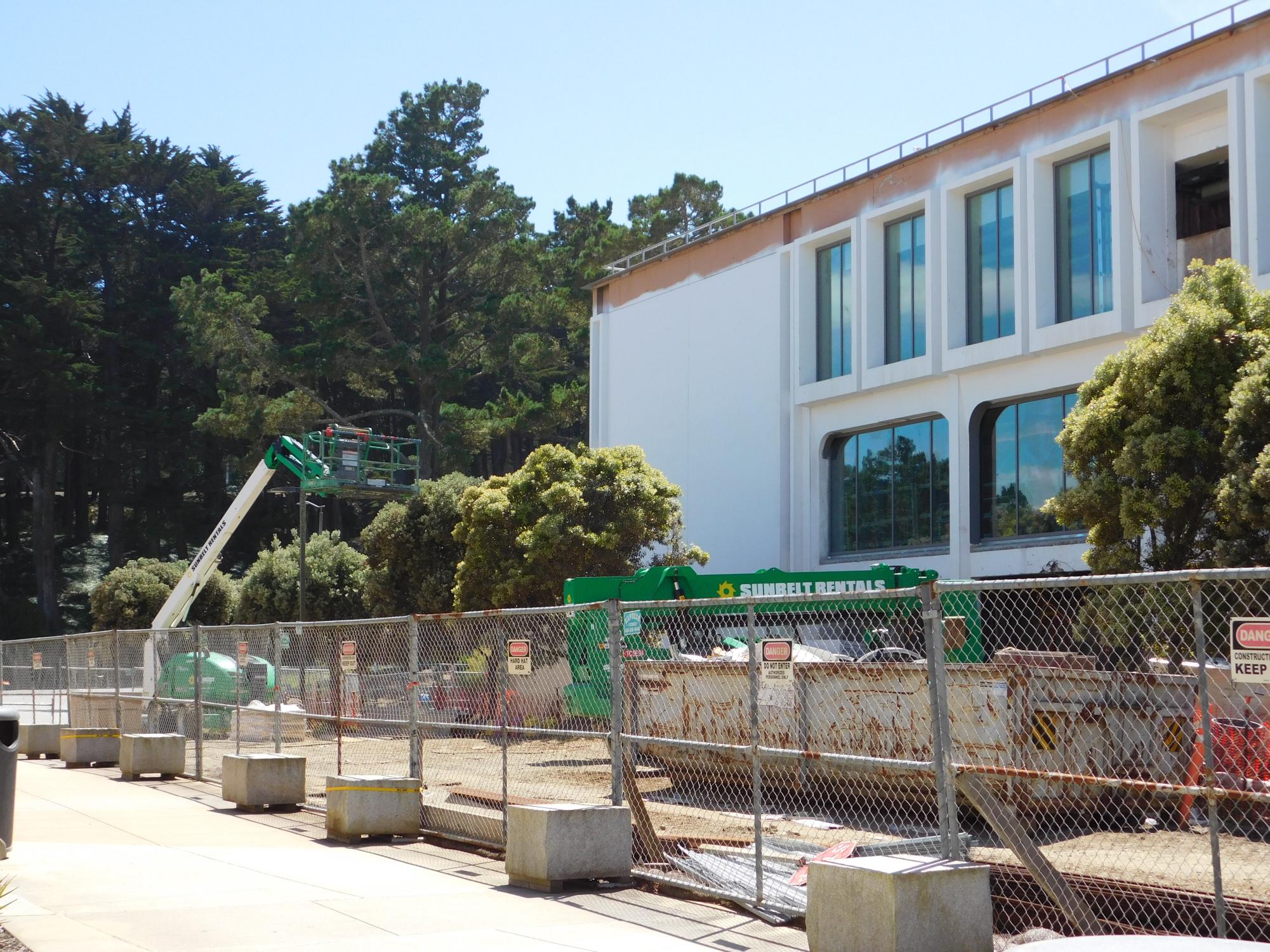 Building 2 with its newly installed windows and white paint.
