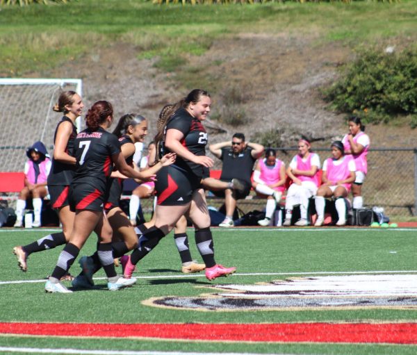 Skyline sophomore right back Saniya Latu celebrates with her teammates after scoring a goal. to put the Lady Trojans up 2-1. 