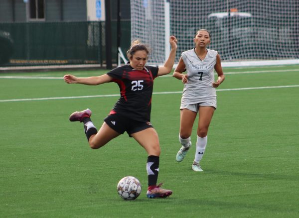 Skyline women's soccer player prepares to pass the ball to a teammate. 