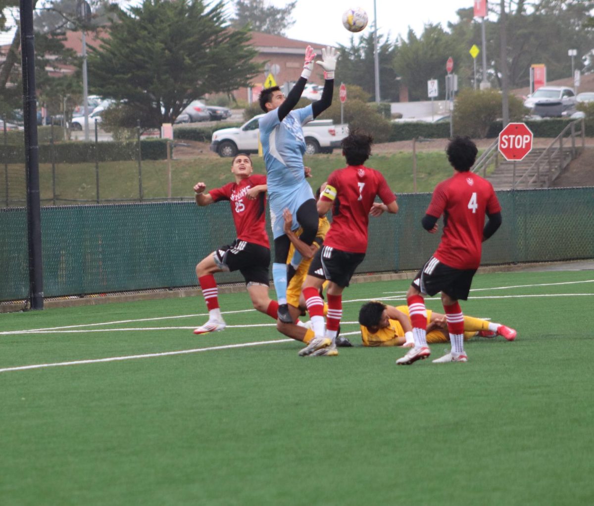 Skyline freshman goalkeeper Matias Kramer jumps over multiple to stop Chabot from scoring on a free kick in the first half.