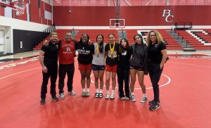 The Skyline women’s wrestling team poses in Bakersfield after competing on Saturday, March 21.