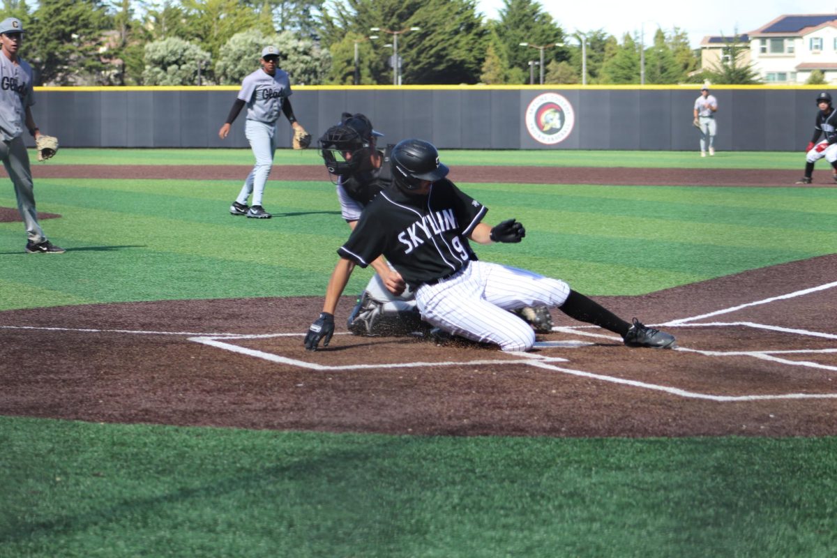 Skyline sophomore outfielder Trey Johnson is tagged out at home plate on close play.